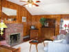 Wonderful country furnishings, pine paneling, fireplace, mini kitchen and more privacy allow for a longer more comfortable stay.